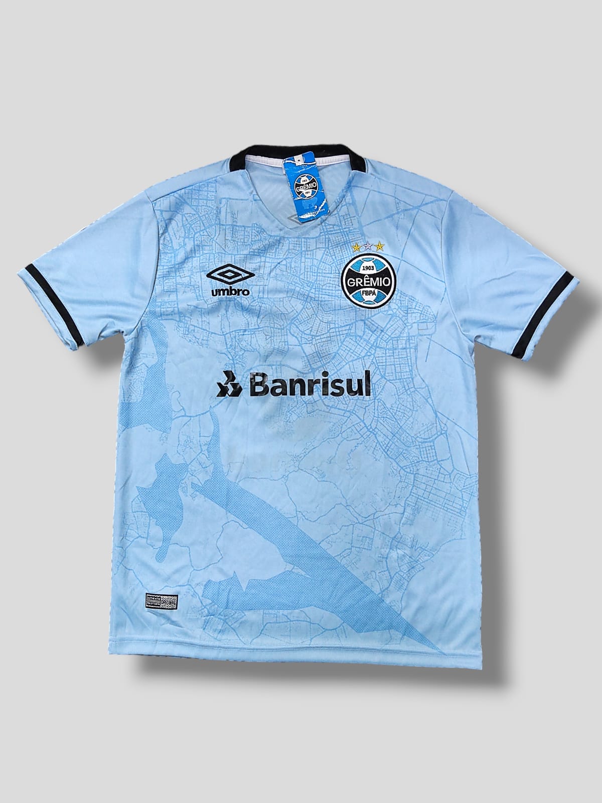 Camisa com escudo Grêmio e logo Umbro azul claro – Atacado no Brás